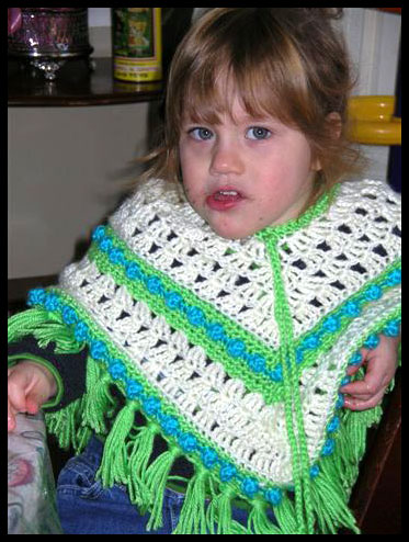 Turquoise & Lime Poncho on Child (click to go back)